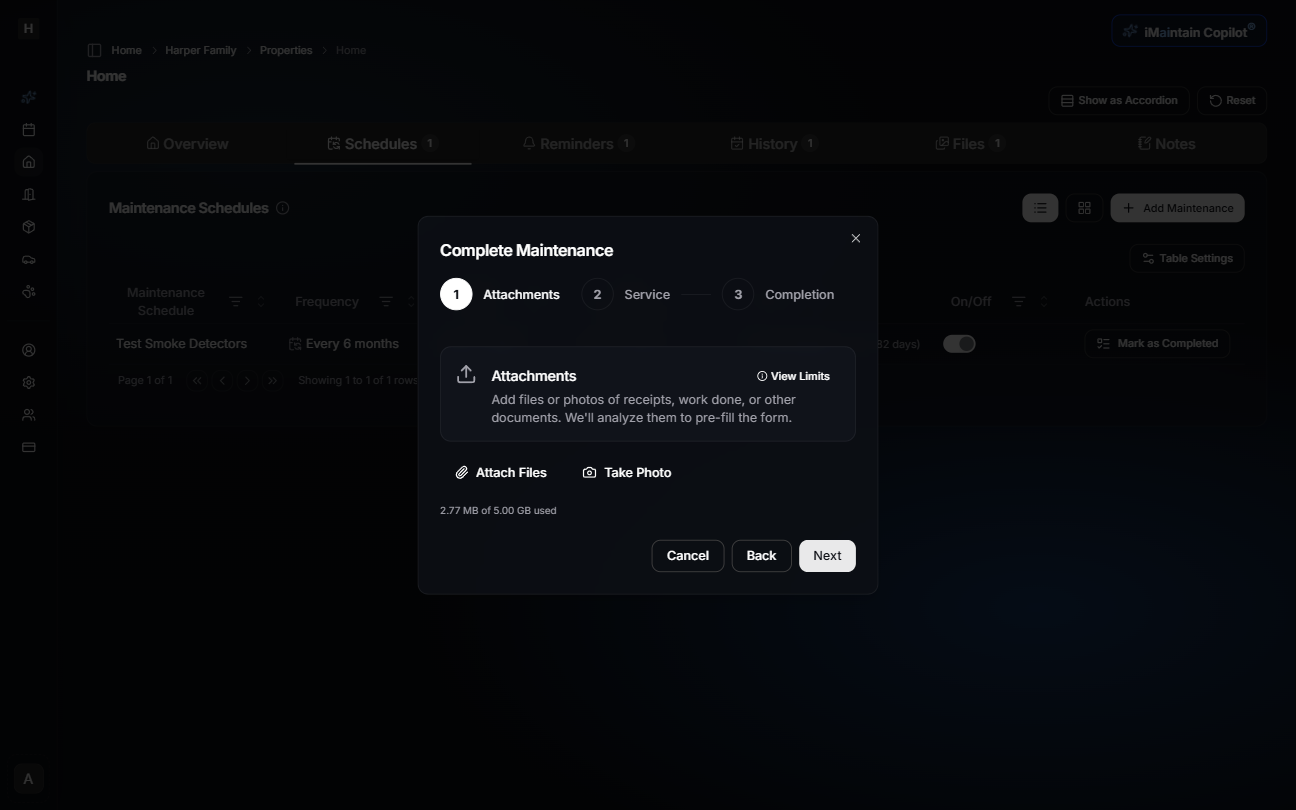 Step 1 of maintenance completion wizard showing file upload interface for attachments
