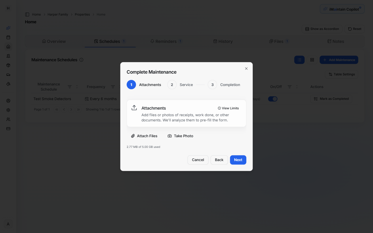 Step 1 of maintenance completion wizard showing file upload interface for attachments