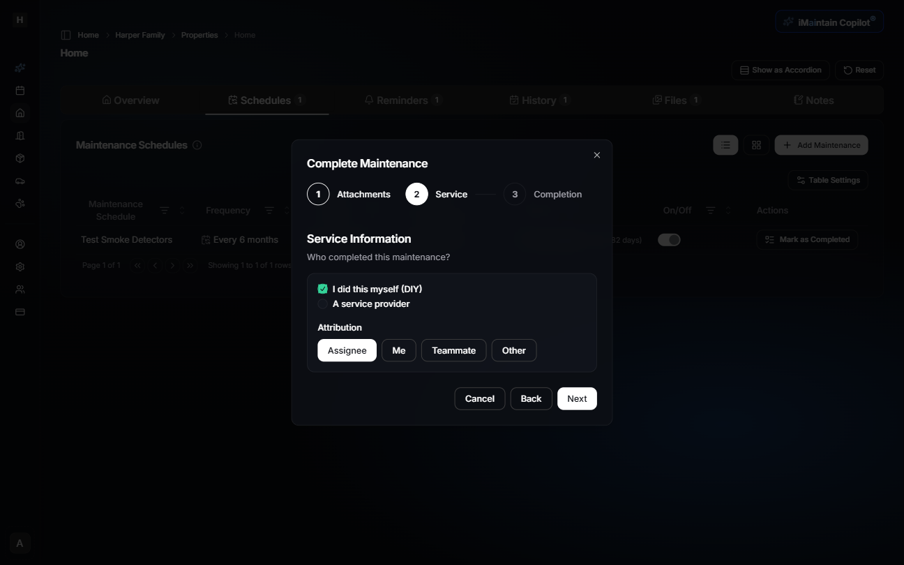 Step 2 of maintenance completion wizard showing service information and attribution options